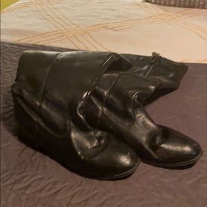 Black worn leather boots